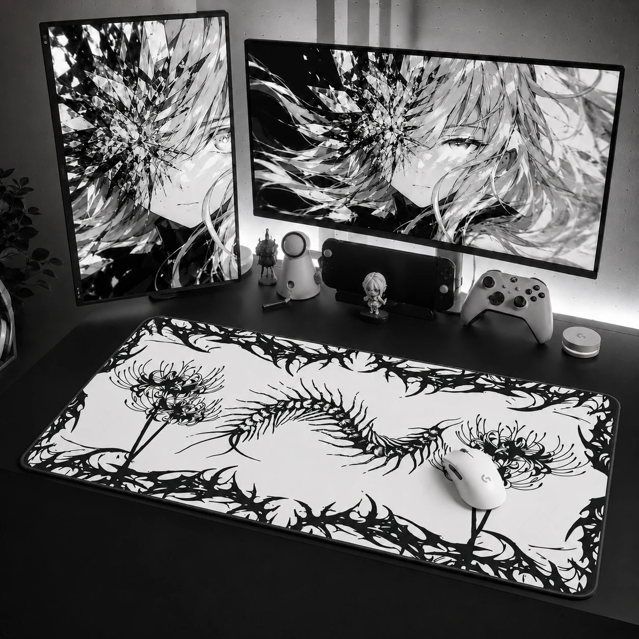Gothic centipede mouse pad with dark botanical artwork on a black desk setup