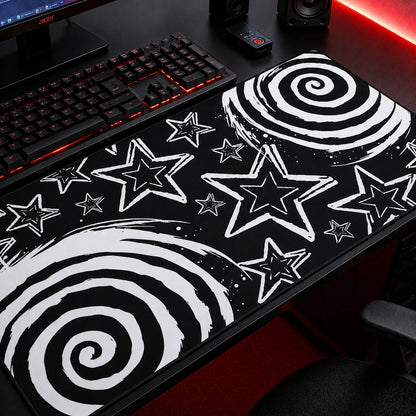 Black and white aesthetic gaming mousepad featuring bold spiral patterns and hand-drawn star illustrations on a dark background. Extended desk mat with grunge, emo, scene, and alternative aesthetic, perfect for gaming setups, workstations, and modern desk decor.