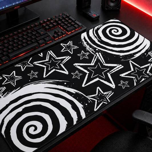 Black and white aesthetic gaming mousepad featuring bold spiral patterns and hand-drawn star illustrations on a dark background. Extended desk mat with grunge, emo, scene, and alternative aesthetic, perfect for gaming setups, workstations, and modern desk decor.