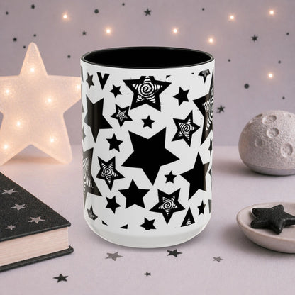 Gothic celestial mug featuring bold black stars and hand-drawn spiral star illustrations, monochrome aesthetic coffee cup for alternative style lovers.