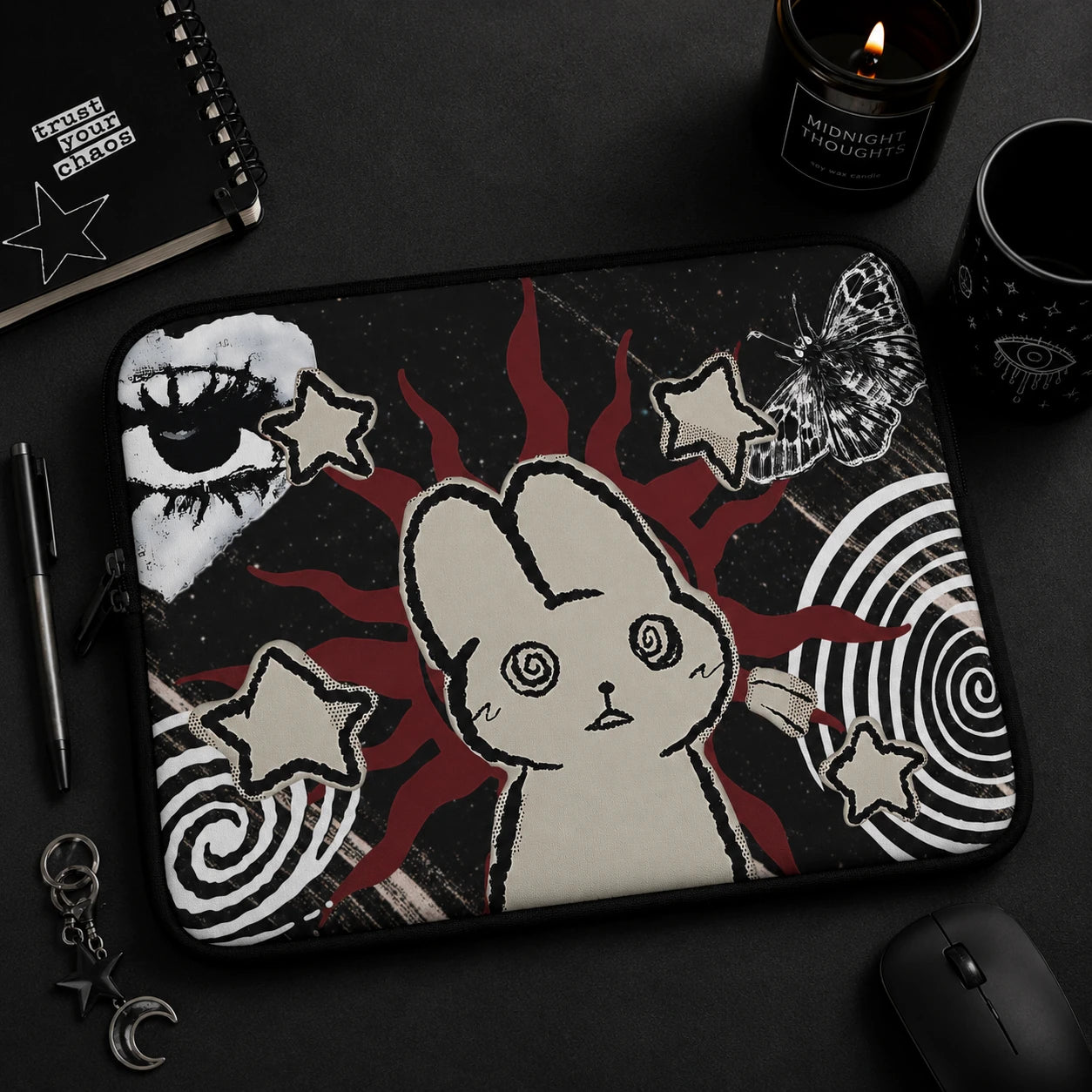 Alternative fashion model holding a gothic laptop sleeve with hypnotic bunny artwork, butterfly illustration, celestial motifs and dark grunge aesthetic.