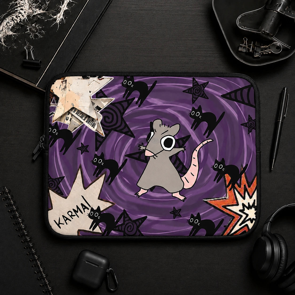 Gothic rat laptop sleeve with black cats, purple swirl background and grunge artwork, aesthetic laptop case flat lay surrounded by dark desk accessories and alternative stationery.