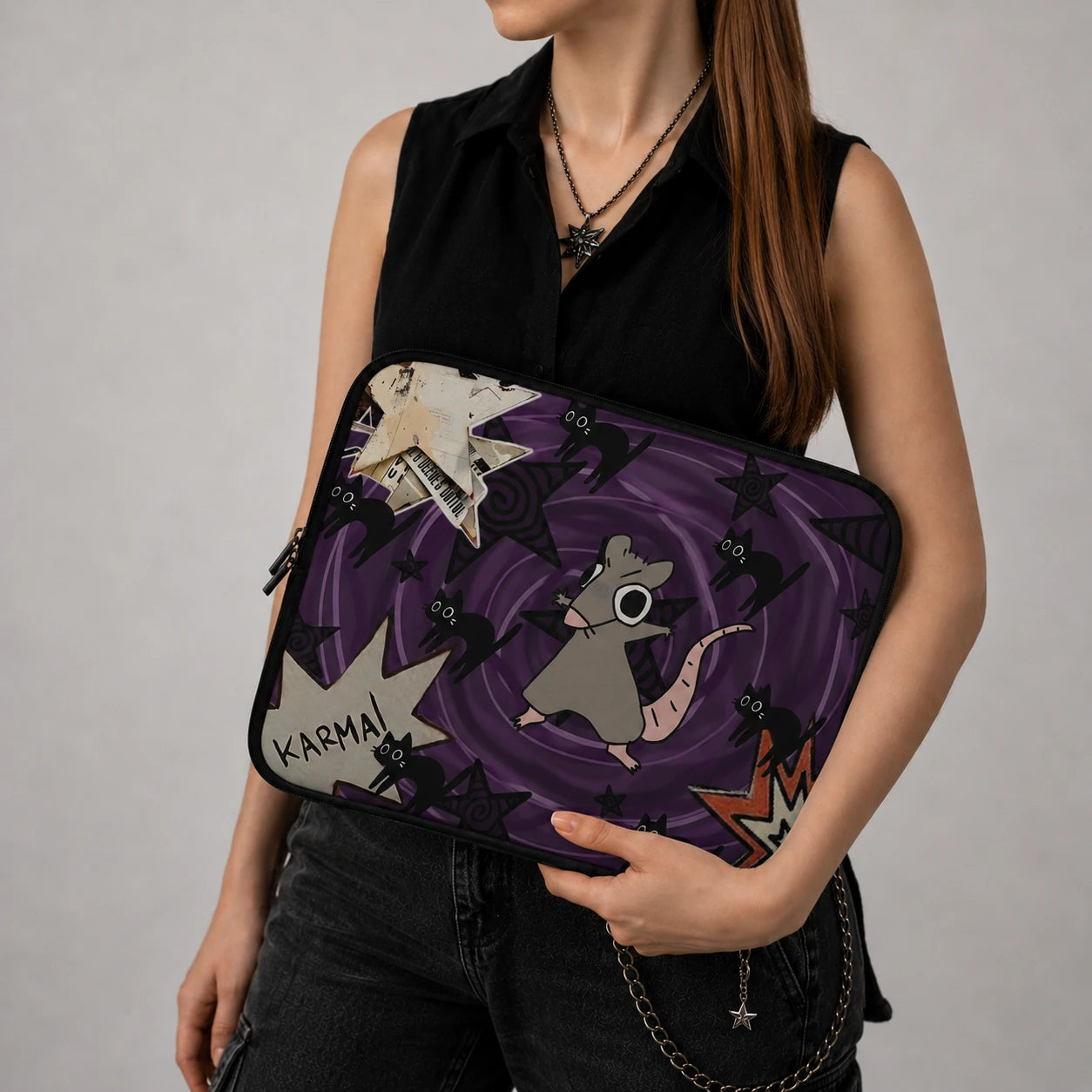 Gothic rat laptop sleeve with black cats and purple grunge aesthetic, protective laptop case held by alternative fashion woman, spooky cute laptop sleeve for gothic and witchy style lovers.