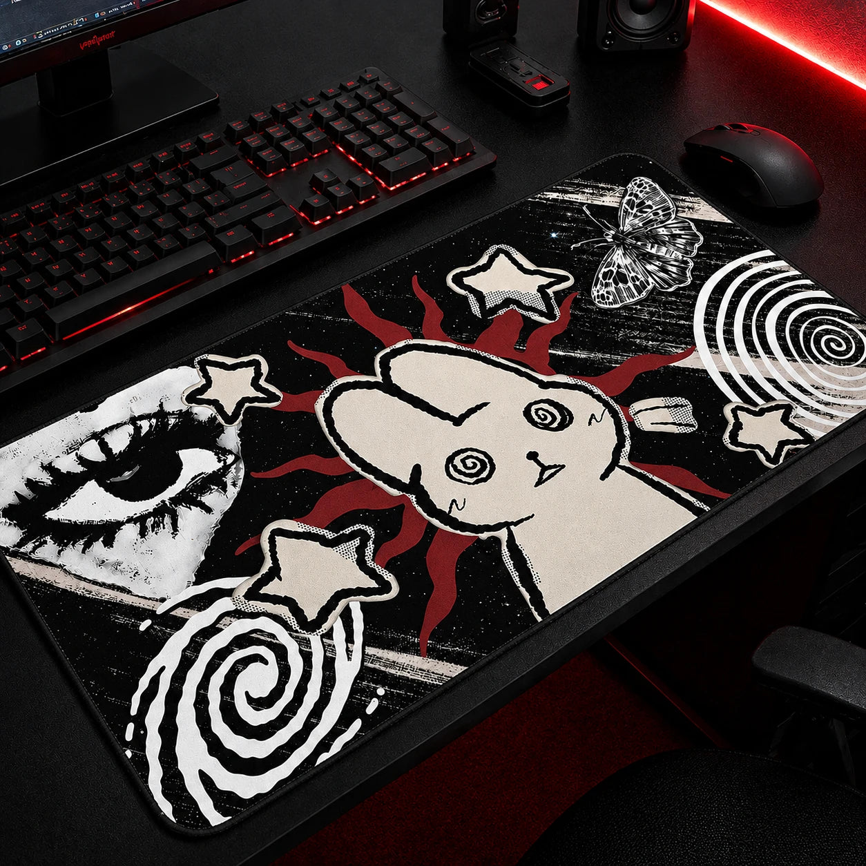 Black and red gothic aesthetic gaming mousepad featuring a cute bunny illustration, grunge eye artwork, spiral patterns, stars, and butterfly accents, oversized desk mat for alternative and dark-themed gaming setups.