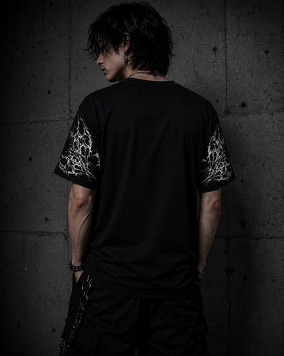 Back view of oversized black gothic butterfly shirt showing sleeve artwork and relaxed unisex fit.