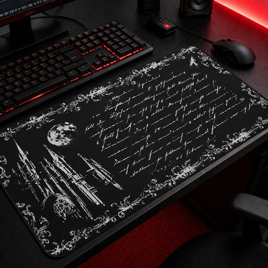 Gothic Victorian castle silhouette against a dramatic dark sky — dark academia desk mat for gamers and fantasy lovers