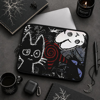 Gothic cat laptop sleeve featuring creepy cute black and white cat artwork, dark alternative desk setup with black accessories and gothic aesthetic decor.