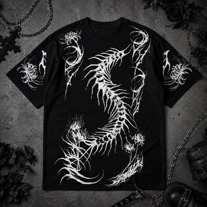 Black oversized gothic t-shirt with large white centipede skeleton graphic and spider lily sleeve prints displayed in a dark aesthetic flat lay.