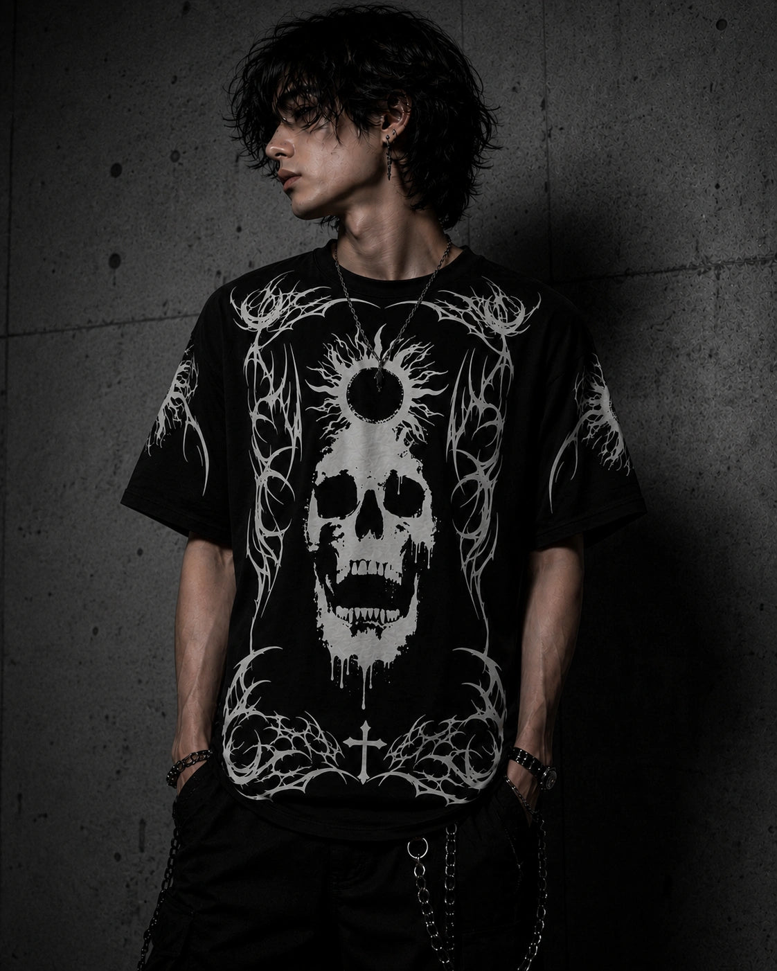 Male model wearing oversized black gothic skull t-shirt featuring white occult artwork, eclipse graphic and alternative streetwear aesthetic.