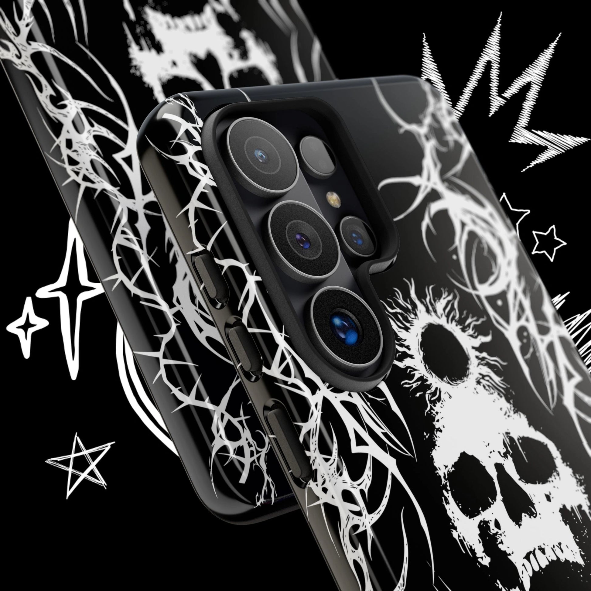 Close-up of a black gothic skull phone case featuring white tribal graphics and alternative grunge artwork.