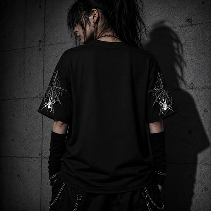 Back view of oversized black gothic spider web t-shirt showing detailed spider web sleeve graphics and relaxed fit.
