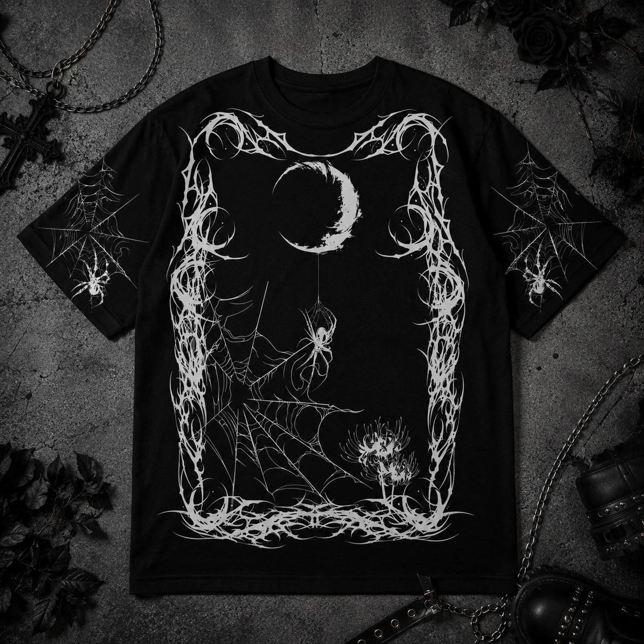 Black gothic spider web t-shirt featuring crescent moon artwork, hanging spider illustration and dark alternative aesthetic design.