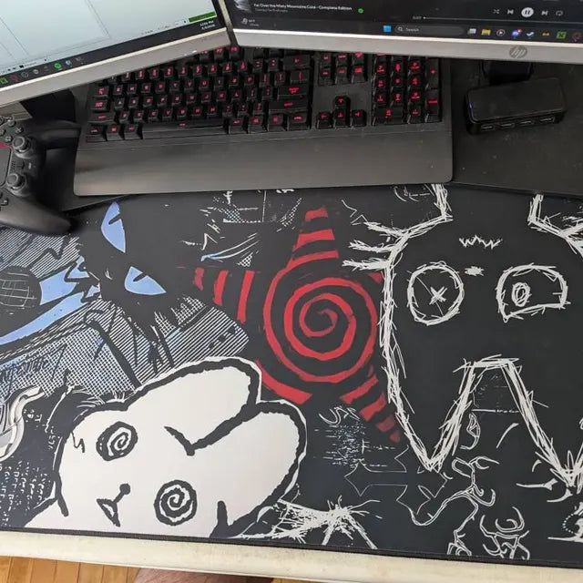 Real customer setup featuring a dark punk creepy cat desk mat, oversized gaming mousepad with black, white and red alternative aesthetic artwork.