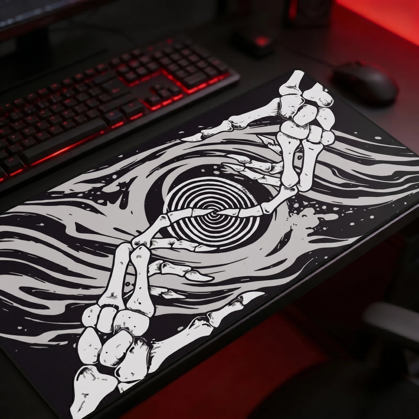 Black and white gothic gaming mousepad featuring skeletal hands forming a heart shape around a hypnotic spiral, dark alternative artwork with flowing abstract waves, oversized desk mat for goth and horror-inspired gaming setups